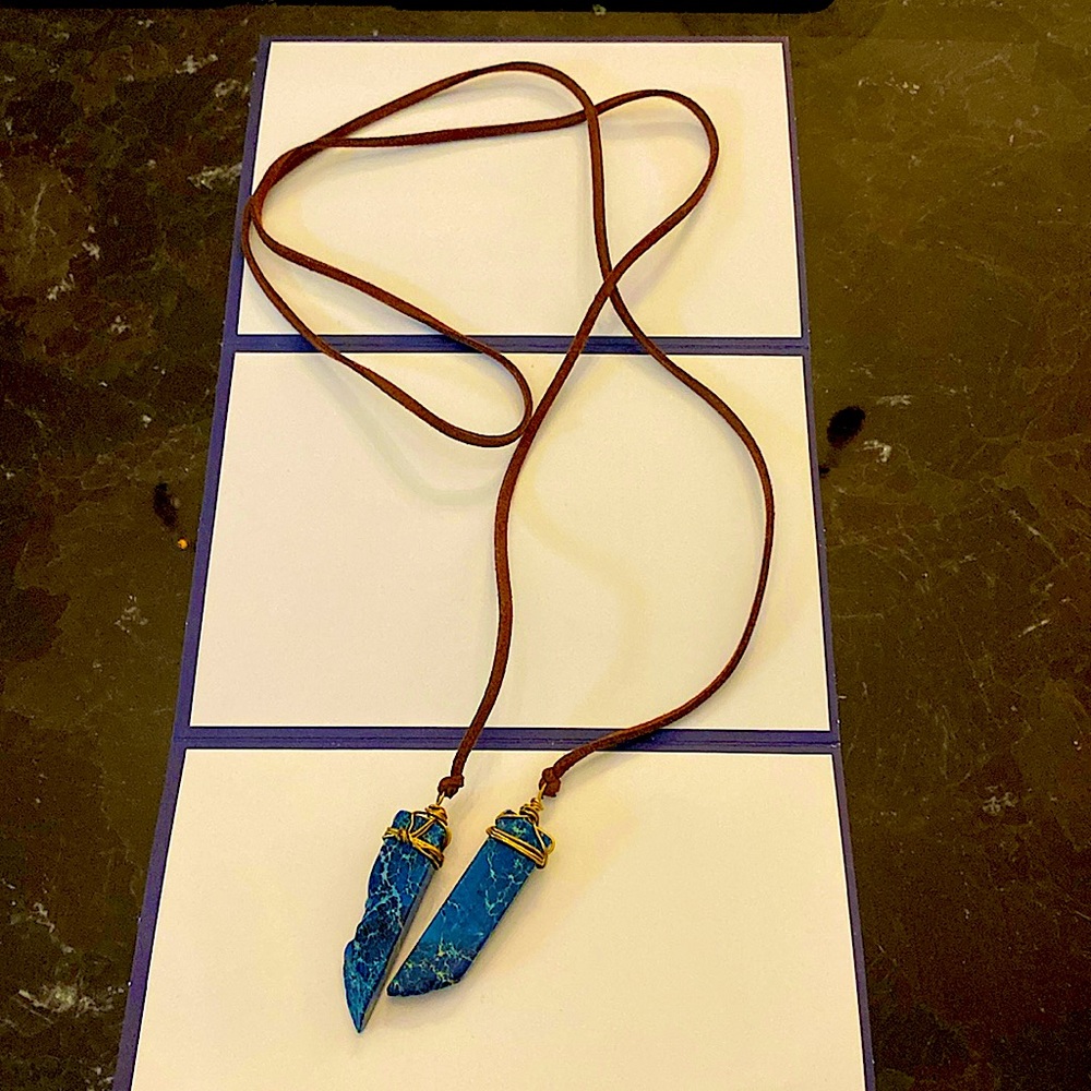Handmade necklace with brown suede leather and gold wrapped blue stones